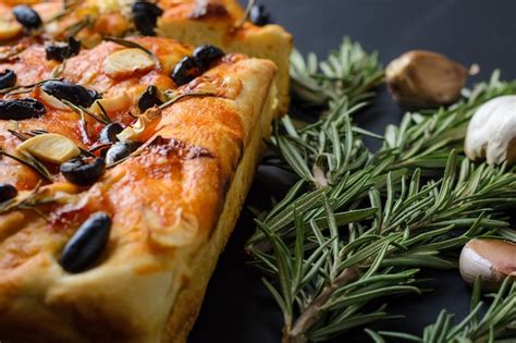 Premium Photo Homemade Italian Focaccia With Rosemary Olives And Garlic