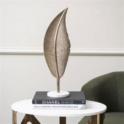 Savoy Champagne Gold Aluminium Feather Sculpture On White Marble Base