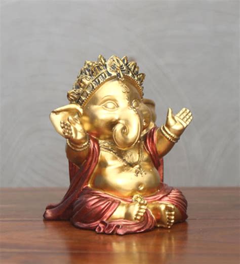 Buy Gold Polyresin Hugging Baby Ganesha Showpiece By Home Online