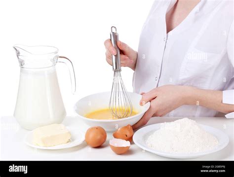 Female Hands Mixing Eggs In Bowl Isolated On White Stock Photo Alamy