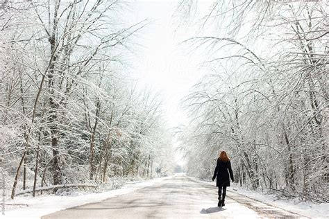 "Redhead Woman Walking On Icy Road In Winter With Snow" by Stocksy ...