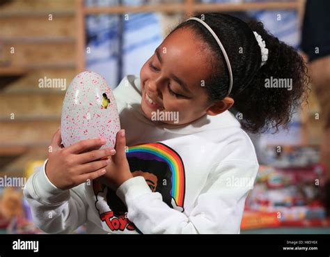 Tiana Wilson 8 Plays With A Hatchimal At The Dreamtoys 2016 Event