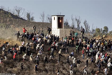 Migrants Storm EU Border Hundreds Swarm Barbed Wire Fence After