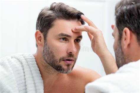 Close Up Portrait Of Perfect Brunet Man Touching Chin And Skin