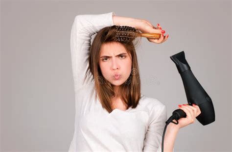 Woman With Hair Dryer Beautiful Girl With Straight Hair Drying Hair