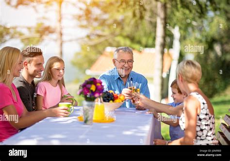 Family with grandparents enjoying outdoor Stock Photo - Alamy