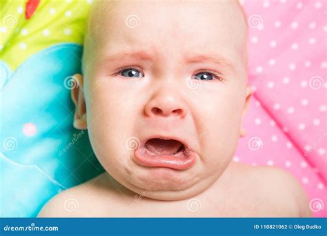 A Cute Baby Crying On A Bed Stock Photo Image Of Childhood Birth