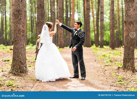 Bride And Groom Dancing In Nature Wedding Dance Outdoors Stock Image