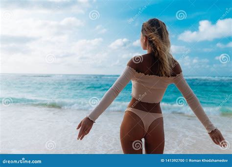 Backside View Of Girl With Booty In Beige Colour Bikini Resting On