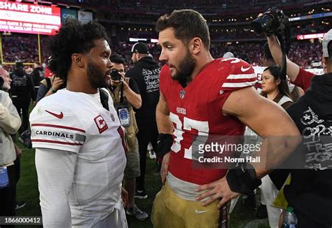 Kyler Murray of the Arizona Cardinals talks with Nick Bosa of the San ...