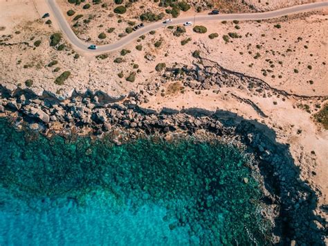 Premium Photo Aerial Overhead Rocky Seashore With Crystal Clear Blue