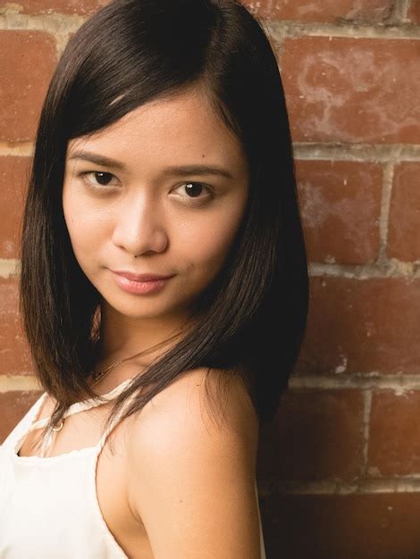 Premium Photo Portrait Of Beautiful Woman Against Brick Wall