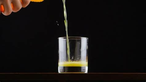 Pouring Orange Juice Soda In Glass In Slow Motion Stock Video