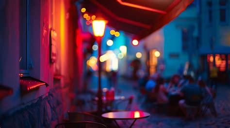 Premium Photo Night City Life Cafe Where People Relaxing Under Tent Neon Blurred Street Lamp