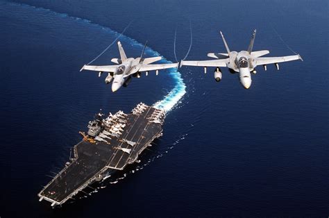 Two F A 18C Hornet Aircraft Of Strike Fighter Squadron 74 Fly Above The