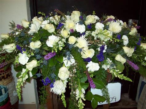 Casket Piece In White And Purple Roses Spider Mums Carnations