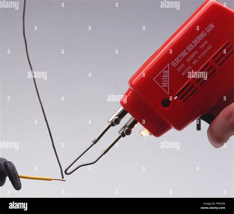 Electrical soldering iron with solder and copper wire Stock Photo - Alamy