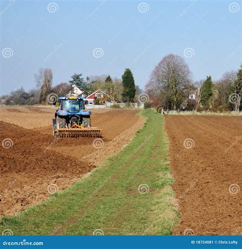 tractor ploughing  field stock image image  vehicles