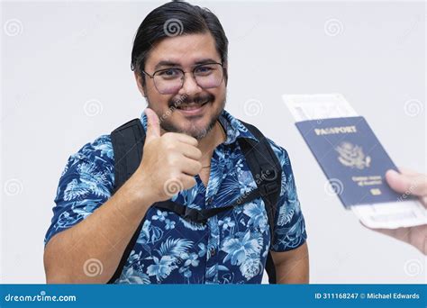 Cheerful Man In A Hawaiian Shirt Gives A Thumbs Up While Receiving His