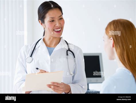 Doctor talking to patient Stock Photo - Alamy