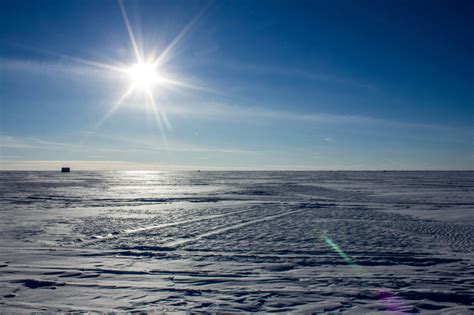 Sun Over The Icy Lake At High Cliff State Park Wisconsin Image Free