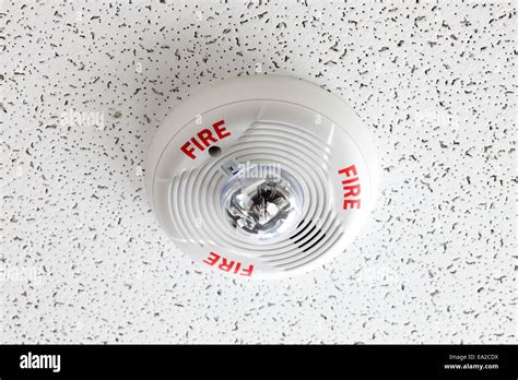 A Ceiling Mounted Fire Alarm And Smoke Detector Stock Photo Alamy