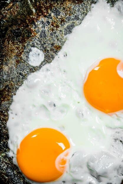 Premium Photo Fried Eggs In A Pan