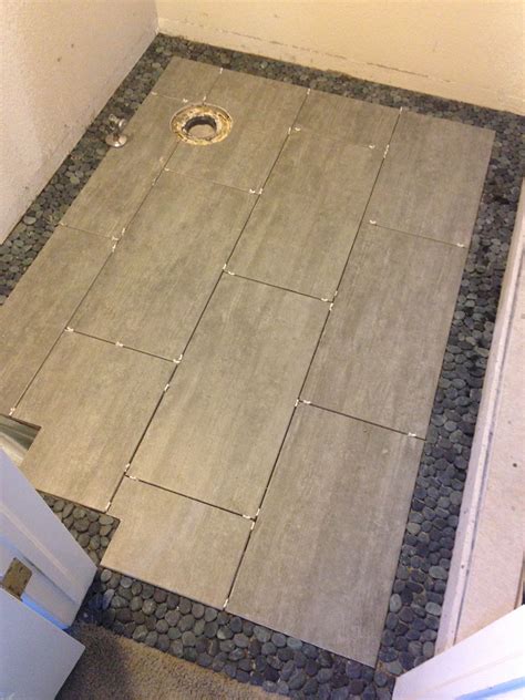 Floor Tile In The Master Bathroom Small Stones For Edging And Large