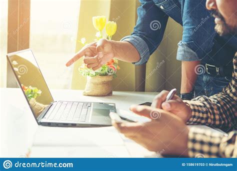 Businessman Calculating Invoice Using Calculator In The Office Stock