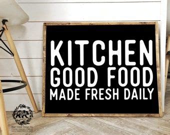 a sign that says kitchen good food made fresh daily