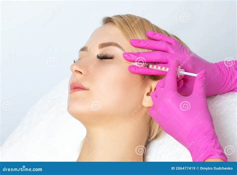 Cosmetologist Makes Rejuvenating Anti Wrinkle Injections On The Face Of