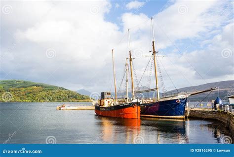 Couple Of Vintage Boats Docked At Inveraray Harbour Scotland Editorial