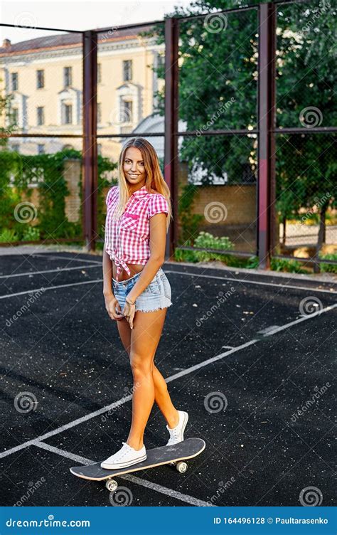 Outdoor Street Portrait Of Cute Girl With Skateboard Stock Photo