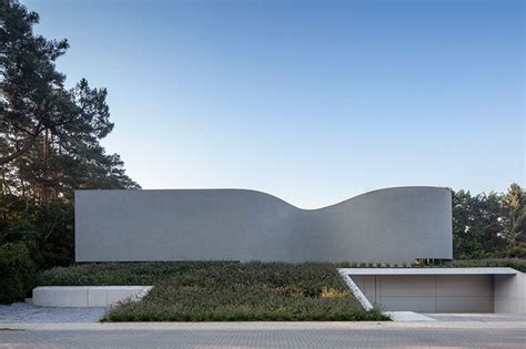 Office O Architects Sculpts Villa Mq From Curved Concrete