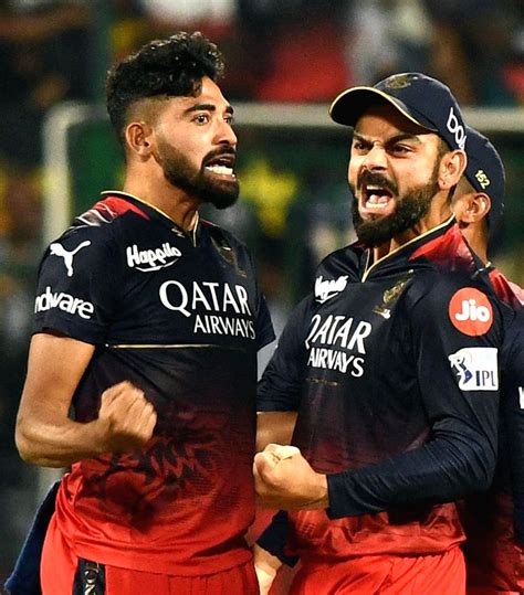 Bangalore : RCB bowler Mohammed Siraj with teammate celebrate the ...