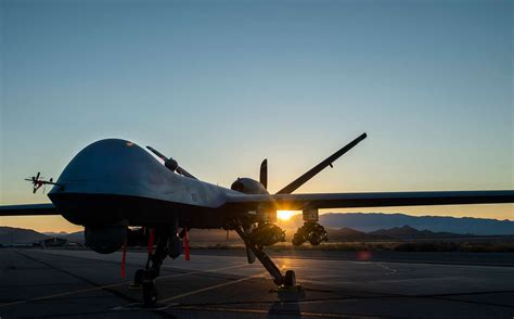 An MQ 9 Reaper Armed With Eight AGM 114 Hellfire Missiles NARA