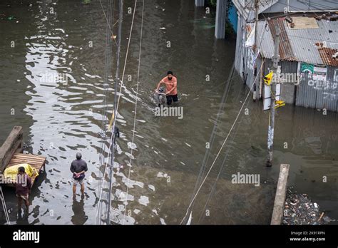 Dhaka Bangladesh Th Oct A Man Moves Through A Waterlogged