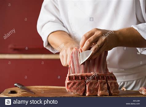 man cutting meat stock  man cutting meat stock images alamy