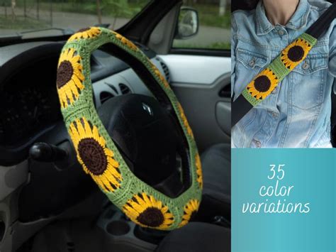 The Interior Of A Car With A Crocheted Sunflower Steering Wheel Cover