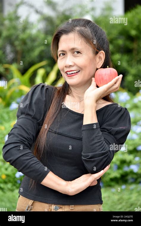 A Happy Filipina Granny With Food Stock Photo Alamy