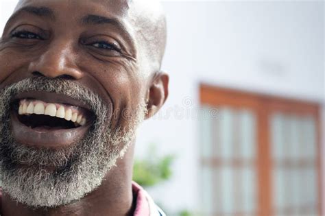 Portrait Of Happy African American Male Doctor Smiling At Doctor S