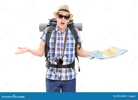 Lost Male Tourist Holding A Map And Gesturing With Hands Stock Photo ...