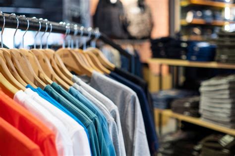 Premium Photo Stack Of Colourful T Shirt Hanging In Fashion