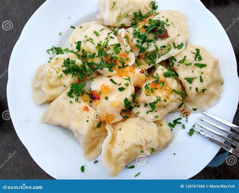 Traditional Polish Cheese and Potato Dumplings with Parsley and Grilled ...