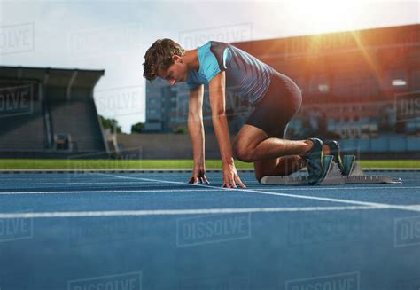 Young Athlete At Starting Position Ready To Start A Race Male Runner