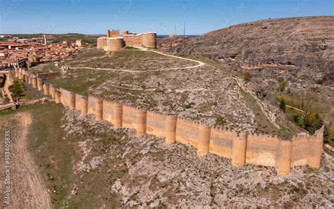 Drone photo of Berlanga de Duero's castle and town. Restored remains of medieval stronghold ...