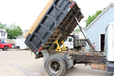 proper techniques  lifting heavy components  dump truck repairs
