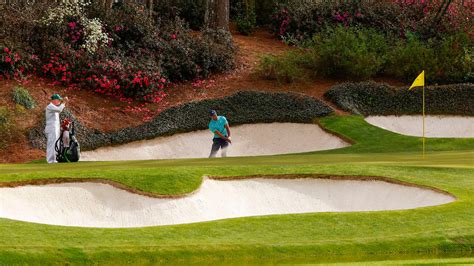 Masters Champion Tiger Woods Plays A Stroke To The No 12 Green During