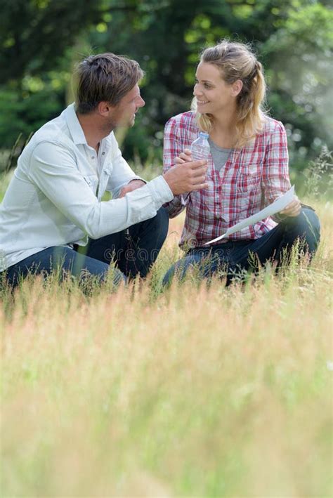 Portrait Couple Sitting On Grass Stock Image Image Of Happiness