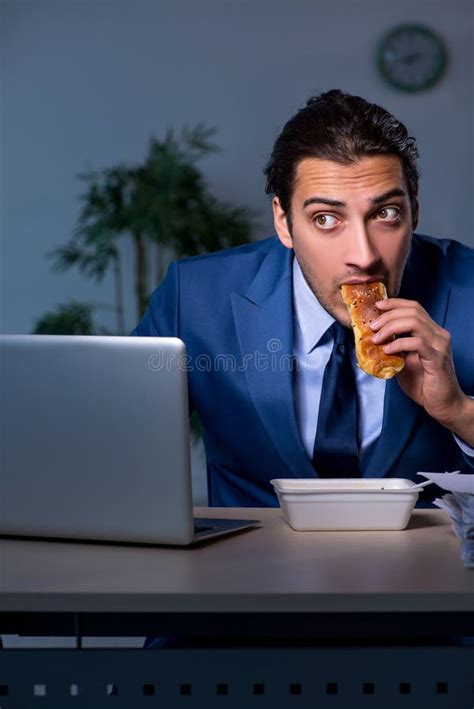 Hungry Employee Working Late In The Office Stock Image Image Of Night